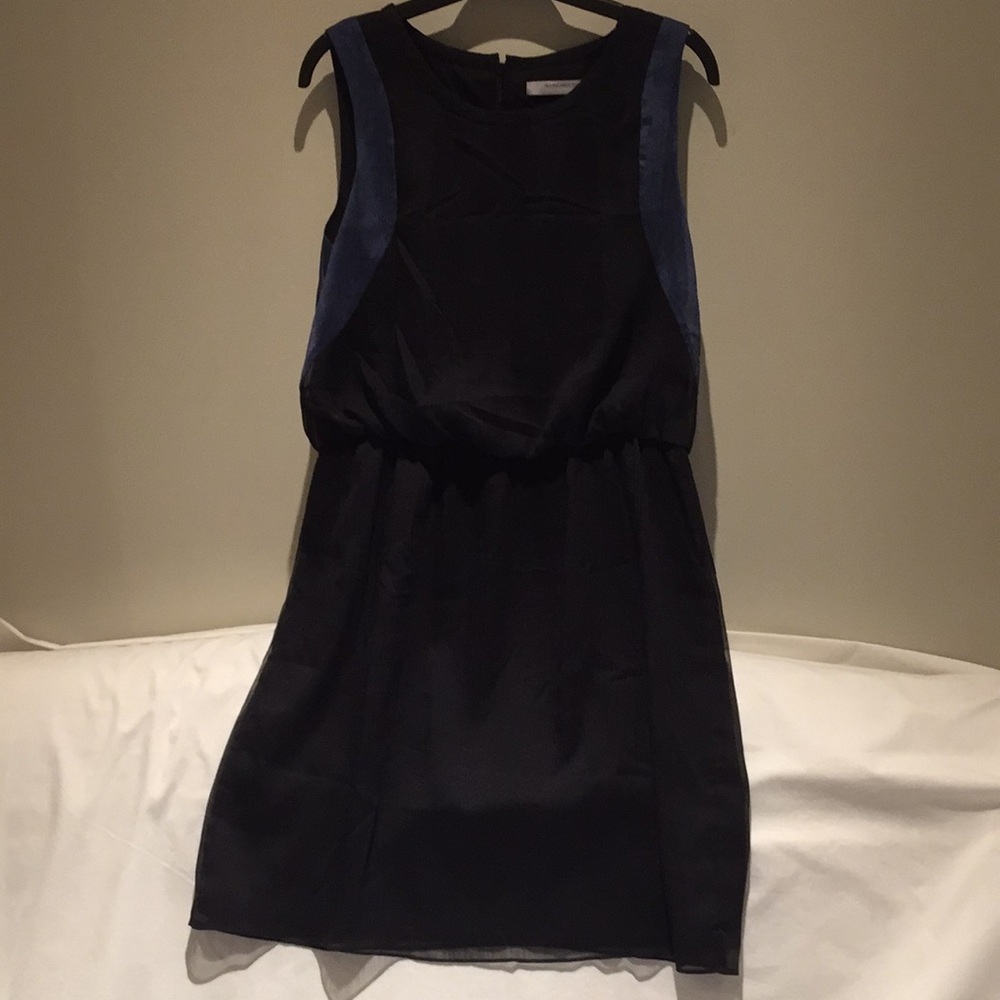 Black dress with blue trim.